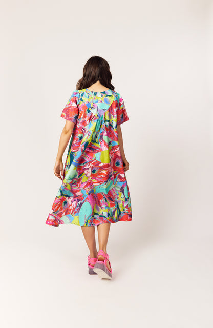 Back view of The Debut Dress in Protea Painterly – vibrant, painterly print organic cotton dress, UK-made fashion.