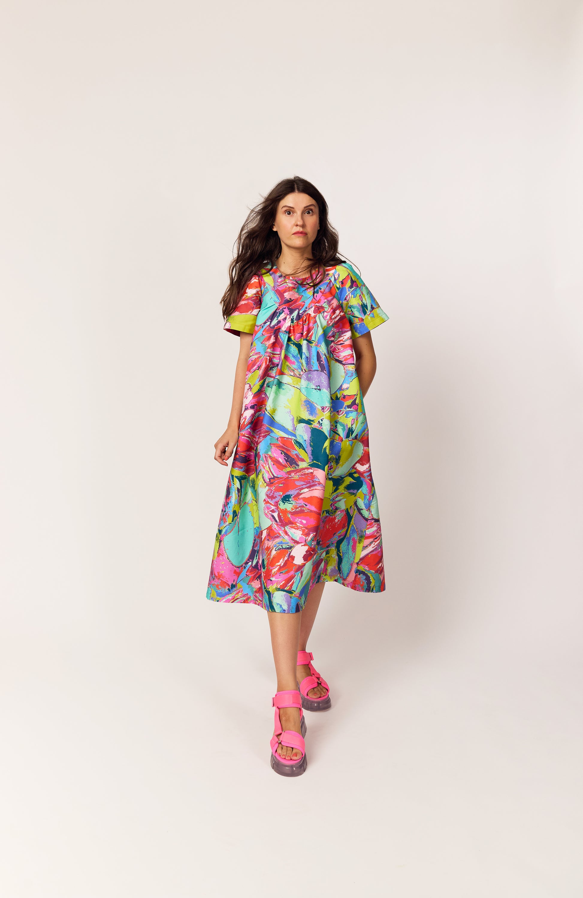 Lanya wearing The Debut Dress in Protea Painterly print – colourful maximal organic cotton midi dress with vintage inspired practical beautiful easy to wear silhouette.